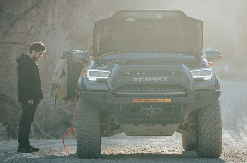Someone airing their tires preparing for an off-road adventure