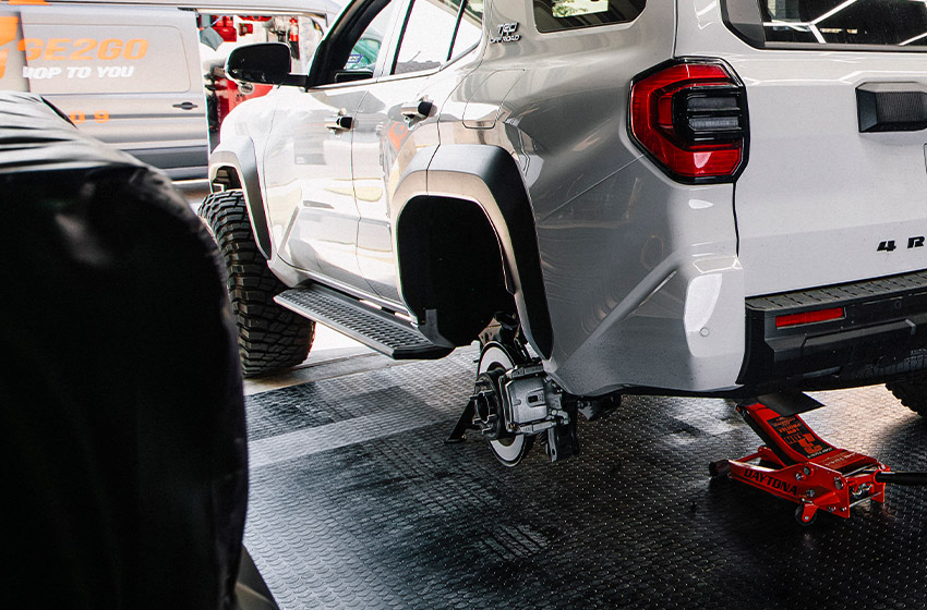 4Runner getting rear wheel replaced in garage